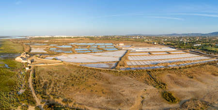 Salt production pans aerial panoramic view, in Ria Formosa wetlands natural park, shot at 60m altitude over Cavacos beach. Algarve, Portugal.の写真素材