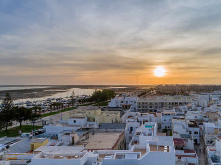 Sunset aerial cityscape in Olhao, Algarve fishing village view of ancient neighbourhood of Barreta,...