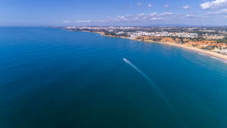 Aerial rocks and cliffs seascape shore view of famous Falesia beach, Algarve, Portugal.の写真素材