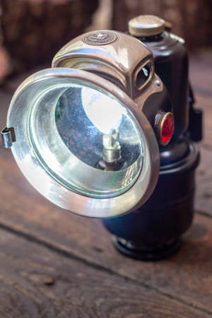 Close up shot of a antique early 1900s carbide cycle lamp, vintage retro style concept.の写真素材
