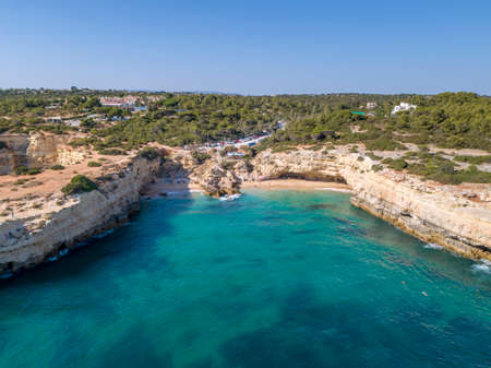 Aerial seascape in Praia Albandeira, popular beach destination of Algarve barlavento rocky cliff coast. South Portugal.のeditorial素材