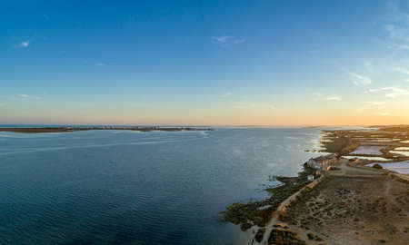 Algarve sunset seascape at Ria Formosa wetlands reserve, southern Portugal, famous nature destination.の写真素材