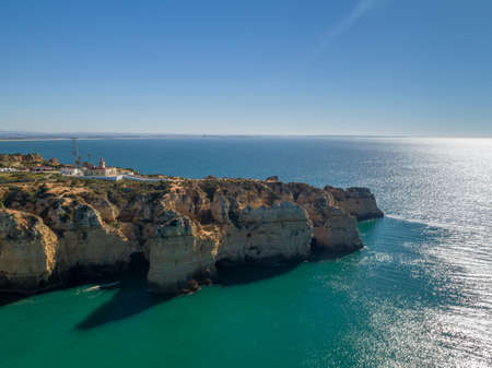 Aerial Scenic seascape, of Ponta da Piedade promontory (cliff formations along coastline of Lagos city), famous natural landmark destination, Algarve. South Portugal.の写真素材