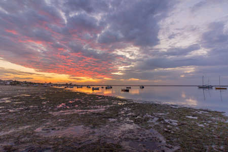 Sunrise cloudy seascape, in Ria Formosa wetlands natural park, shot in Cavacos beach. Algarve....