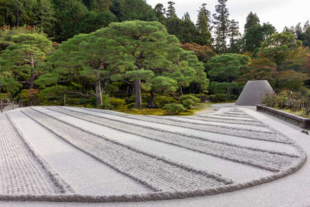 Ginkakuji temple of the Silver Pavilion, Japanese dry sand and gravel zen garden during autumn...