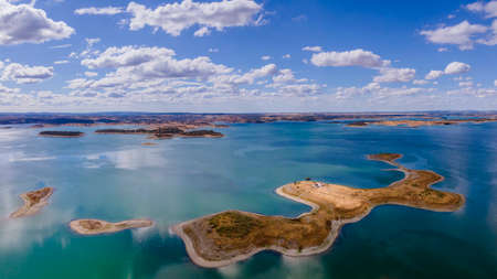 Aerial view of Alqueva Dam artificial Lake, near aldeia da luz river beach, Alentejo tourist destination region, Portugal.の写真素材