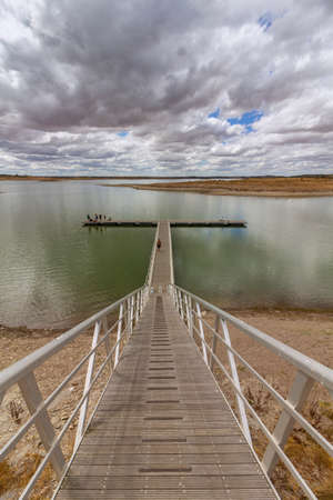 View of Alqueva Dam artificial Lake at aldeia da luz river beach, Alentejo tourist destination region, Portugal.の写真素材