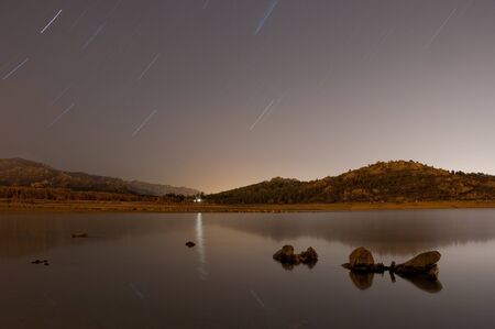 sunset on the marsh lake house navacerrada. navacerrada, madridの写真素材
