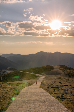 Hikers walking on a mountain at sunset in Navacerrada, Madrid. Spainの写真素材