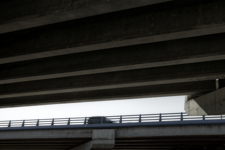 Car in motion seen from below the bridge. Abstract background.