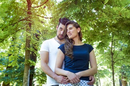 Young couple in love enjoying a sunny day in the parkの写真素材