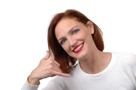 Woman with phone gesture on white backgroundの写真素材