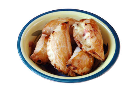 Empanadas on a bowl isolated on a white background