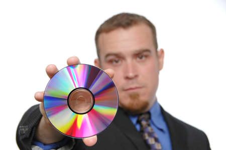 Bussinessman holding CD isolated on whiteの写真素材