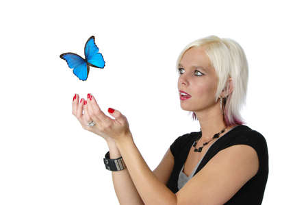 Beautiful blond letting a butterfly go isolated on white