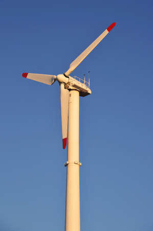 Wind turbine aginst a blue skyの写真素材