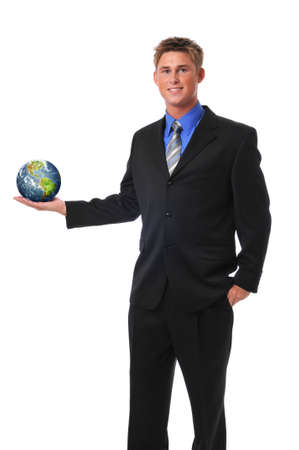 Young businessman holding the earth isolated on whiteの写真素材