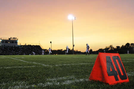 Football field at the 40th yard at nightの写真素材