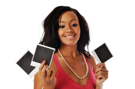 African american holding snapshots and smiling isolated on whiteの写真素材