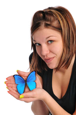 Young woman holding a blue butterfly isolated on a white backgroundの写真素材
