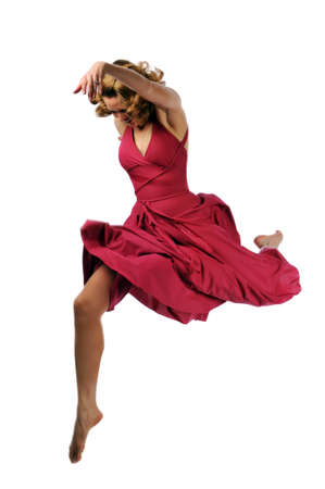 Young ballerina performing against a white backgroundの写真素材