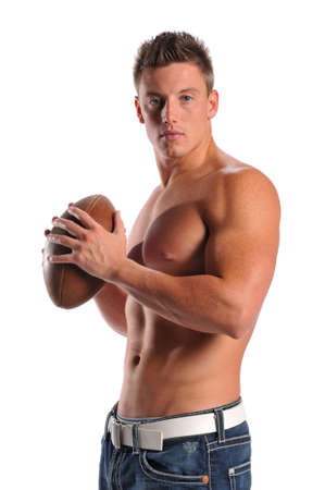 Muscular young man holding a football isolated on a whithe backgroundの写真素材