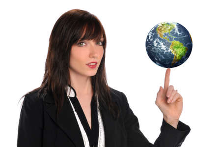 Young businesswoman balancing the earth isolated on a white backgroundの写真素材