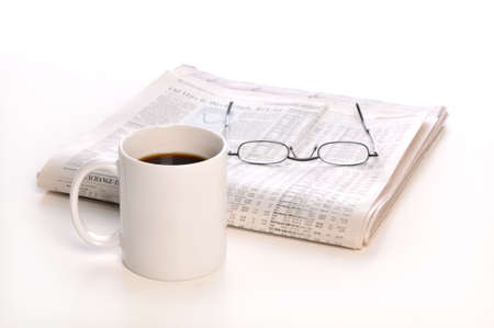 Businesspapers, cup of coffee and glasses isolated on a white background -Focus is on the cup-の写真素材