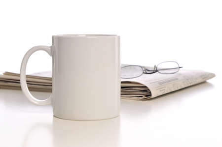 Cup of coffee, newpaper and glasses isolated on a white backgroundの写真素材