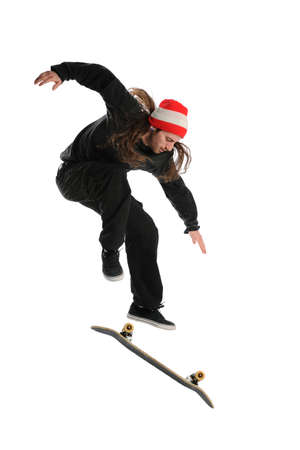 Skateboarder doing a trick isolated on a white backgroundの写真素材