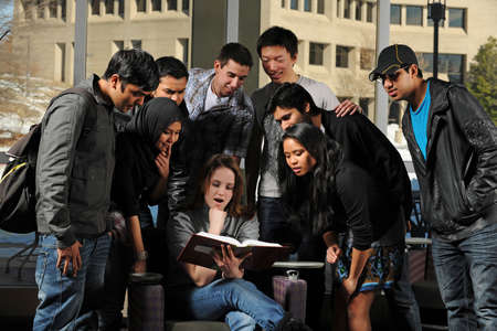 Diverse Group of Students in College Campus with buildings on the backgroundの写真素材