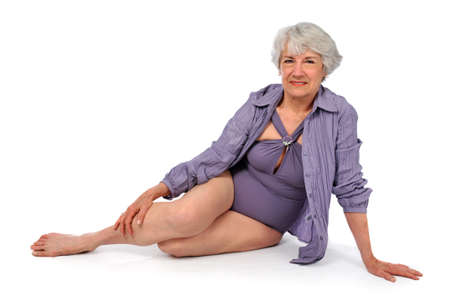 Attractive Senior Citizen Lady wearing a swimming suit on a white backgroundの写真素材
