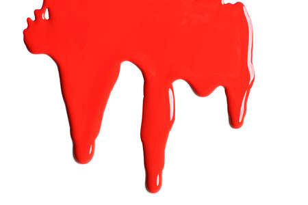 Red paint dripping on a white backgroundの写真素材