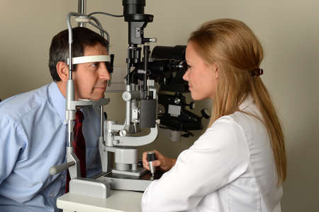 Young Eye Doctor with her patient during an examination