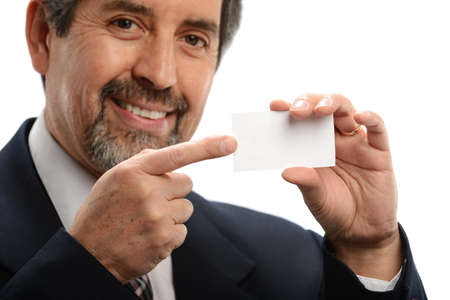 Mature hispanic businessman holdind a blank card with focus on the hands