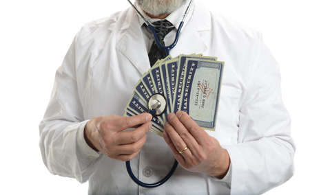 Doctor with esthetoscope and social security cards isolated on a white backgroundの写真素材