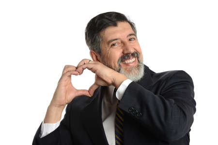 Businessman making a heart gesture with his hands isolated on a white backgroundの写真素材