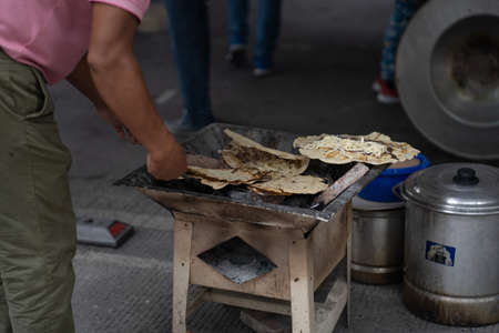 person cooking quesadillasの写真素材