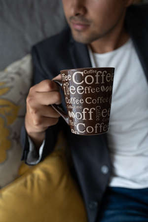 man drinking coffeeの写真素材