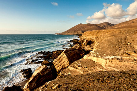 large fractured rocks on beach