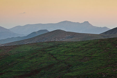 Volcanoes of Fuerteventura at sunset on a hazy dayの写真素材