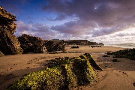 Sunset on the beach at Polzeath Cornwall England UK Europeの写真素材