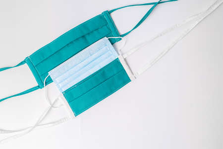 face masks of different sizes on white backgroundの写真素材