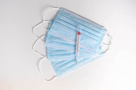 surgical masks with thermometer white background