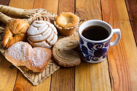 Traditional mexican sweet bread and black coffeeの写真素材