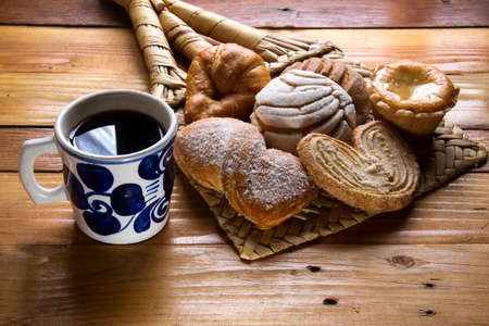 Mexican cup of coffee and tradtional sweet breadの写真素材