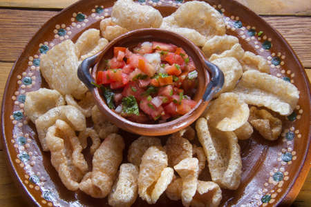 Mexican pork chicharron and fresh sauceの写真素材