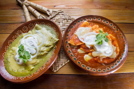 Mexican green and red enchiladasの写真素材