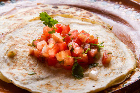 Traditional mexican sincronizada with ham and sauce pico de galloの写真素材