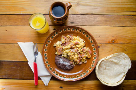 Tasty breakfast: scrambled eggs with hamの写真素材